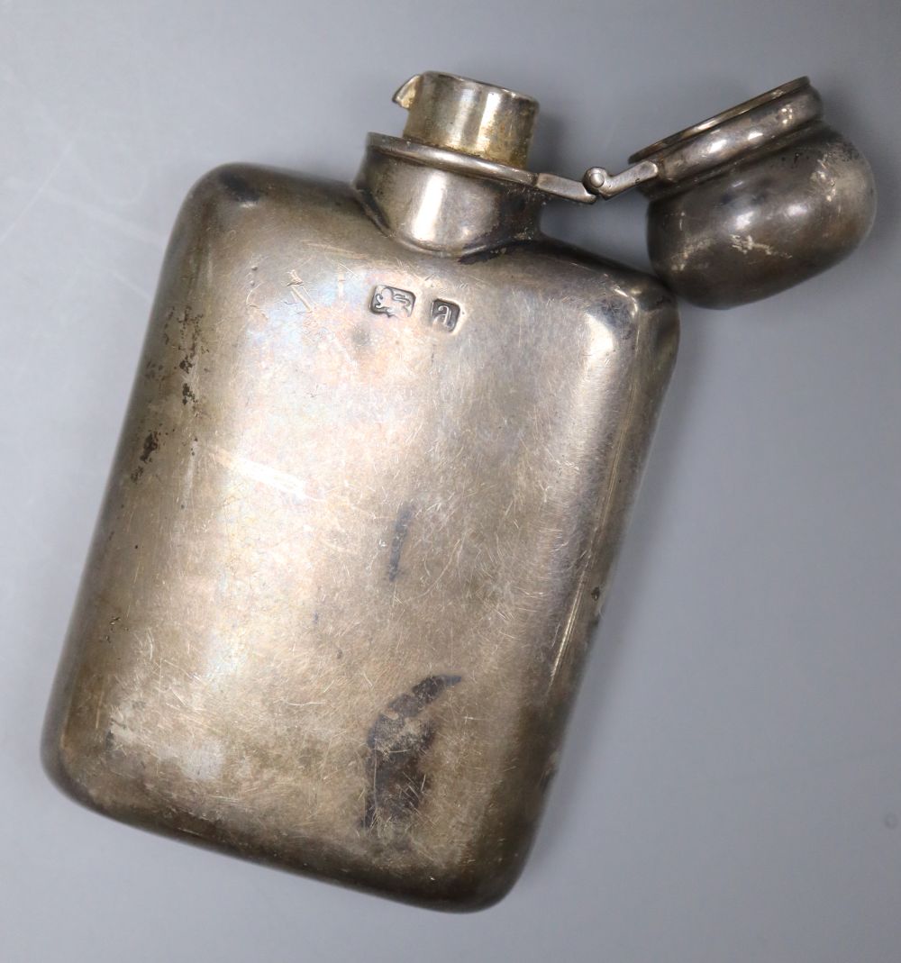 A late Victorian small silver hip flask, George Unite, Birmingham, 1900, 87mm and a silver mounted capstan inkwell, 13.5cm.